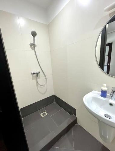 a white bathroom with a sink and a mirror at Luxury villa with private pool in Casablanca