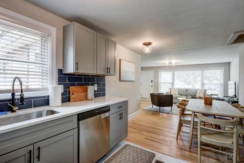 a kitchen with a sink and a table in a room at Renovated 2 BR home close to Lancaster attractions in Lancaster