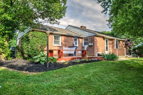 a brick house with a porch and a lawn at Renovated 2 BR home close to Lancaster attractions in Lancaster