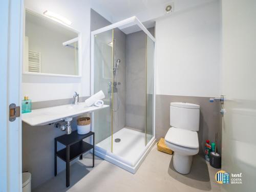 a bathroom with a shower and a toilet and a sink at Villa Azalia in Castillo de Aro