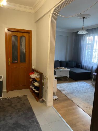 a living room with a door and a couch at Kiralık in Istanbul