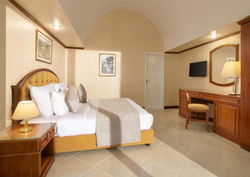 Postel nebo postele na pokoji v ubytování JAZ Pyramids Resort