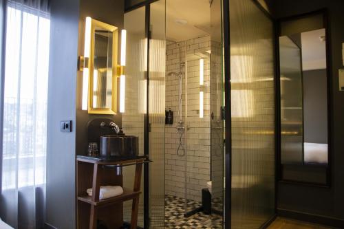 a bathroom with a shower and a sink at Letoh Letoh San Sebastián in San Sebastián