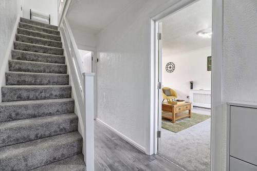 a staircase in a home with white walls at The Only Way is Basildon in Basildon