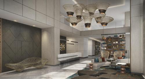 a lobby with several chandeliers and a living room at Citadines Bacolod City in Bacolod