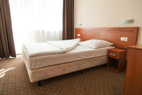 
Łóżko lub łóżka w pokoju w obiekcie Papaver Hotel
