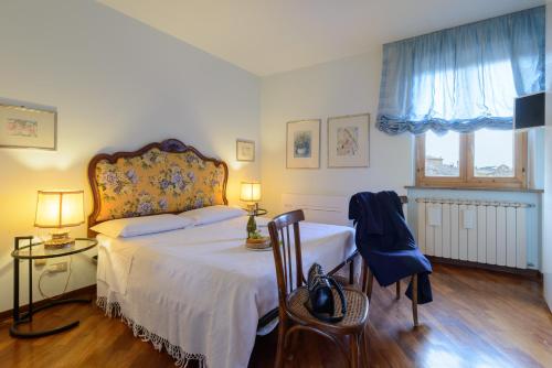 En eller flere senge i et værelse på La Dimora di Amedeo