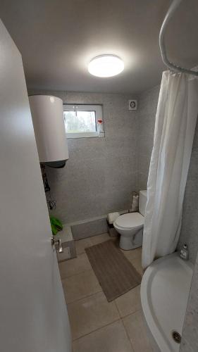 A bathroom at House by the sea for up to 8 people