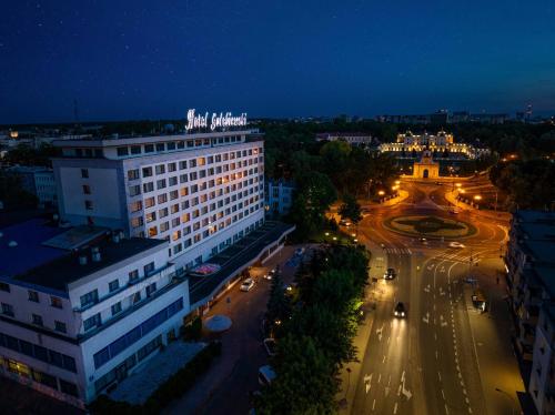 an aerial view of a city at night at Hotel Gołębiewski Białystok in Białystok