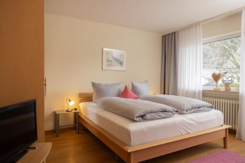 En eller flere senge i et værelse på Ferienwohnung Rosenwirth