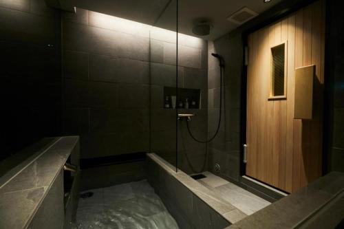 a bathroom with a shower with a tub and a sink at ARCH - Vacation STAY 78045v in Tokyo
