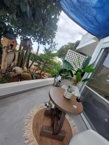 a table in front of a window with plants on it at George's point of view in Naousa