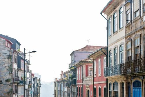 a group of buildings on a city street at GuestReady - Virtudes Apartment Balcony 1 in Porto