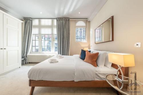 Postelja oz. postelje v sobi nastanitve Royal Studio Apartment in Mayfair