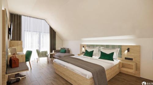 a bedroom with a large bed with green pillows at Haus Weitblick by Spinnerhof in Sasbachwalden