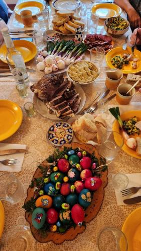 a table full of food on top of a table at Casa de vacanta Julius in Padis
