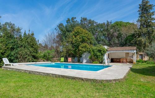 a swimming pool in a yard with a gazebo at Gorgeous Home In Miramas in Miramas