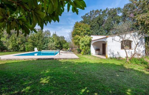 a house with a swimming pool in a yard at Gorgeous Home In Miramas in Miramas