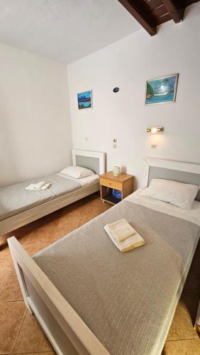 Postel nebo postele na pokoji v ubytování ASTORIA lindos