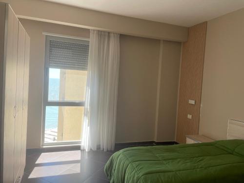 Ένα ή περισσότερα κρεβάτια σε δωμάτιο στο Hotel Nais Beach