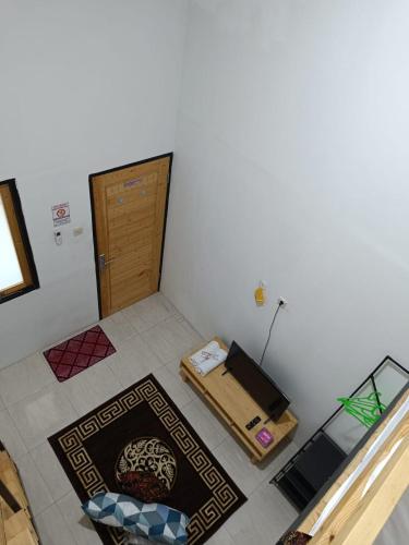 a room with a door and a box on the floor at Jogja Amor Hotel in Demangan