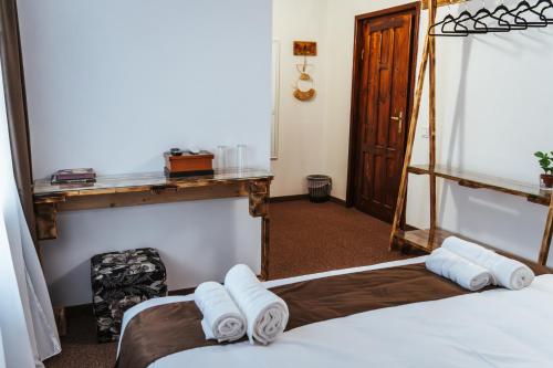 a hotel room with two beds and a mirror at Casa Rosu in Cluj-Napoca