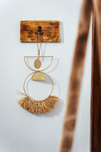 a glass shelf hanging on a wall at Casa Rosu in Cluj-Napoca
