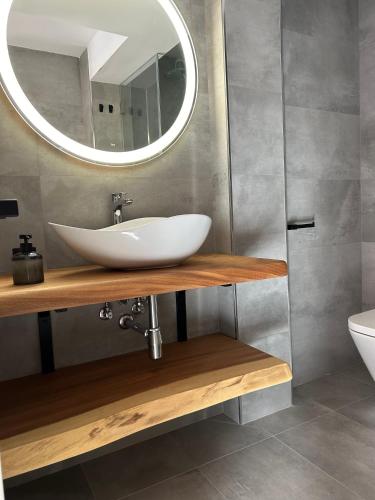 a bathroom with a sink and a mirror at La Repera in Palamós