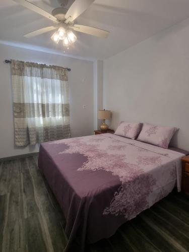 Postel nebo postele na pokoji v ubytování Diamond Cut Villa and Suites