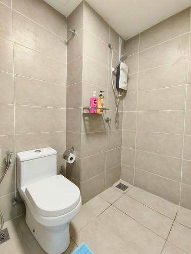 a bathroom with a toilet and a phone at Cozy MRT-Linked Unit, DSara Sentral SOVO #DS1 in Sungai Buluh