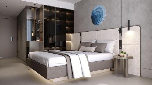 a bedroom with a large white bed and a table at FOUR HILLS HOTEL in Antalya