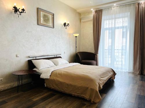 Llit o llits en una habitació de Kyiv Panna Apartment