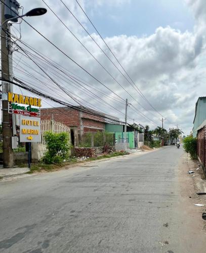 an empty street with a sign on the side of the road at Maria Hotel in Ba Tri