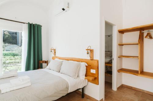 Letto o letti in una camera di Agriturismo Il Canto delle rane