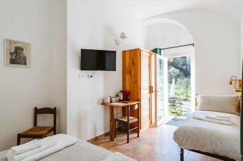 Letto o letti in una camera di Agriturismo Il Canto delle rane