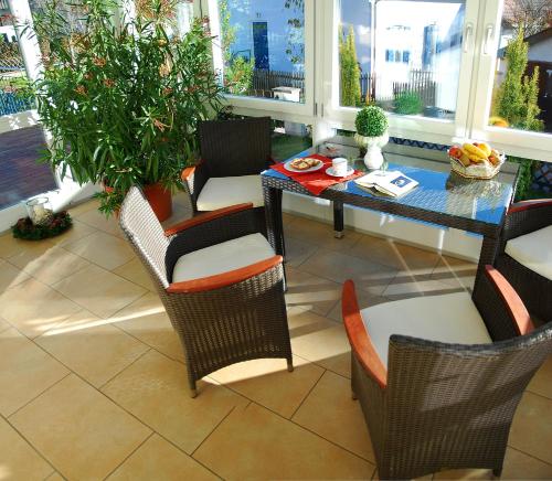 a dining room with a table and chairs at Boutique Hotel Angerer in Murnau am Staffelsee