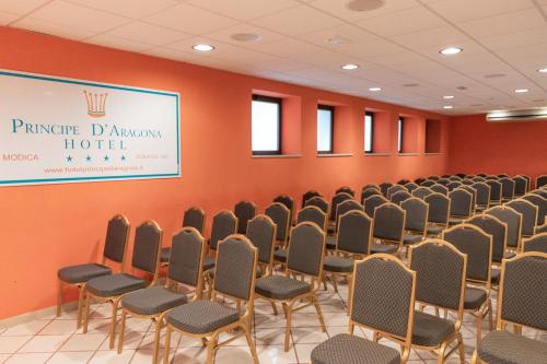 a conference room with chairs and a sign on the wall at Hotel Principe d'Aragona, Sure Hotel Collection by BW in Modica