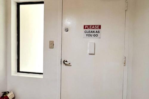 a sign on a door that reads please cleans you go at 8 Bedroom Subic Bay/300MBPS/Big Screened Lanai in Sawat