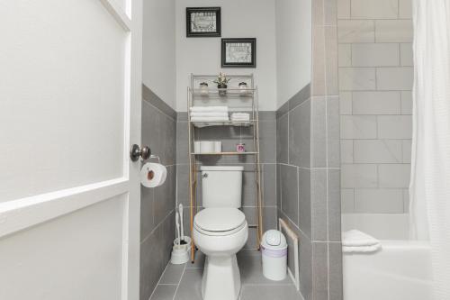 a small bathroom with a toilet and a shower at Cool and Cozy Pad Close to Everything in Los Angeles