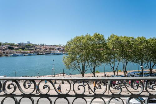 a row of bikes parked on a bridge near a body of water at GuestReady - Innvict Residences in Porto