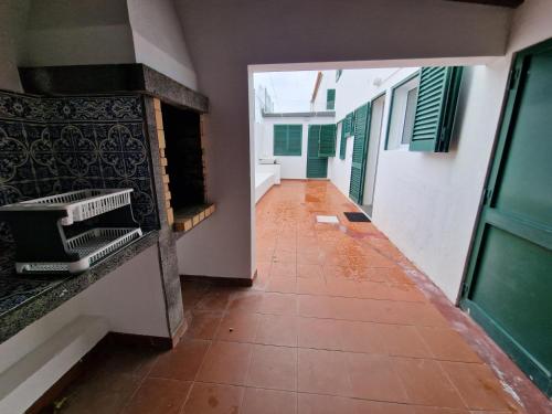 a hallway of a house with a tile floor at Wild Blue By SVL in Ponta Delgada