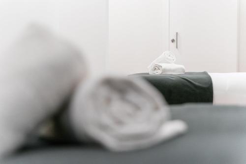 Postel nebo postele na pokoji v ubytování GuestReady - Uptown suites