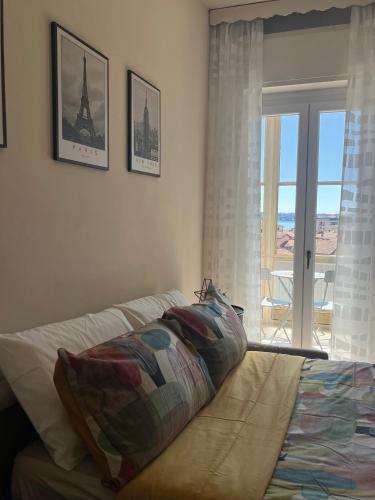 Postel nebo postele na pokoji v ubytování VITTORE 11 SQUARE
