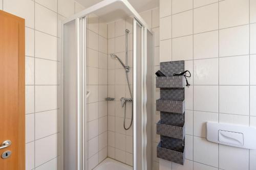 a bathroom with a walk in shower with a shower at Yachthafenresidenz-Wohnung-5102-806 in Kühlungsborn