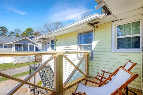 a porch with two chairs and a house at Firefly Hideaway near Riverwalk in North Augusta