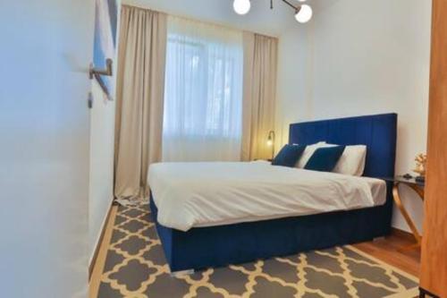 Llit o llits en una habitació de Luxury Apartment Blue