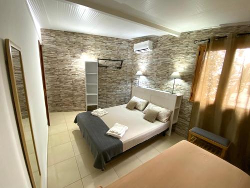 a bedroom with a bed in a room at Villa GAUDÌ in Sant'Isidoro