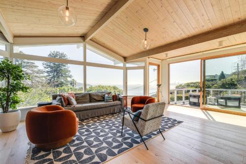 a living room with a couch and chairs and windows at Sausalito Oasis - 3 Mi to Golden Gate Bridge! in Sausalito