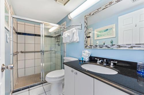 a bathroom with a sink and a toilet and a shower at Harbour Place Unit 106 in Orange Beach