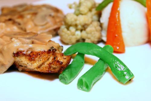 a plate of food with meat and vegetables on it at The Beehive in Male City